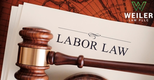 A paper that says "labor law" next to a gavel