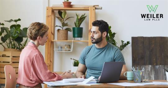 two employees talking