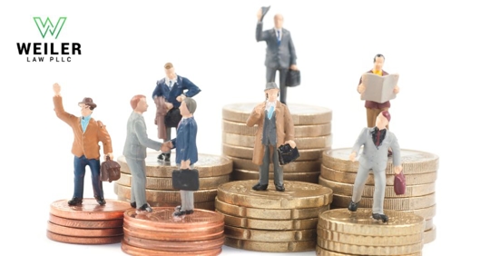 figurines of different workers standing on top of a pile of coins